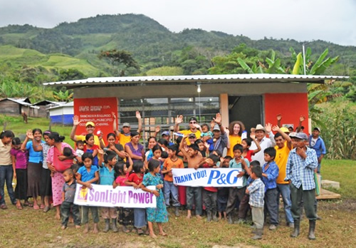 Mexicans holding 'Thank you P&G' banner