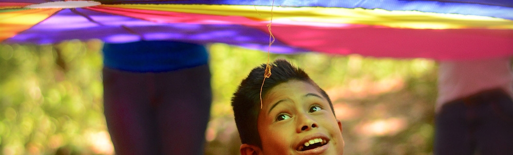 Honduras - Boy looks up at parachute at school in Yamaranguila