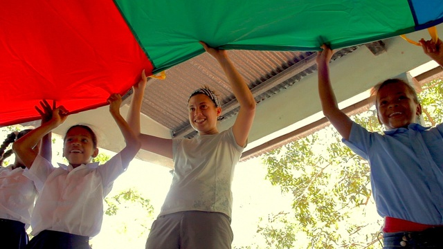 Panama - Fia and kids at parachute during fiesta (Isaac Stambaugh / Rebel Pilgrim)